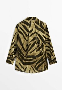 Long-sleeve shirt in green and brown, featuring a tiger stripe pattern, with a relaxed fit and buttoned cuffs. Back detail includes a pleat.