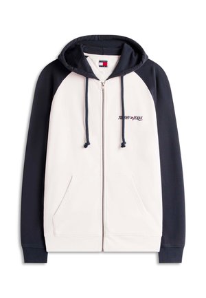 Sudadera con capucha y cremallera completa, con parte delantera crema y mangas azul marino, cordones de capucha azul marino, bolsillos delanteros y logo "Tommy Jeans" en el pecho.