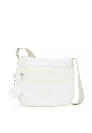 White crossbody bag made of soft fabric, featuring a zippered front pocket, detachable pom-pom charm, and an adjustable strap.