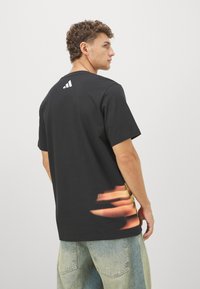 adidas Performance TRAE TEE - Marškinėliai su spaudiniu - black