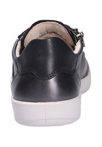 Black leather sneaker with a smooth texture and rounded back. Features a white rubber sole and a zip closure on the side.