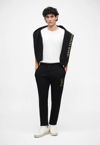 Armani Exchange TROUSER UNISEX - Calças de fato de treino - black