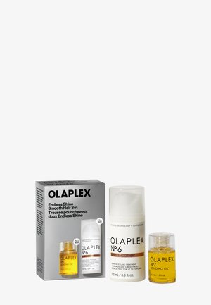 Ensemble capillaire Olaplex Endless Shine avec bouteille No.6 Bond Smoother et bouteille No.7 Bonding Oil à côté de l'emballage du produit.