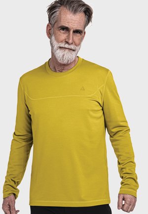 Langarm-Sportshirt in leuchtendem Gelb, aus strukturiertem Stoff mit nahtlosem Design und einem dezenten Logo auf der Brust.