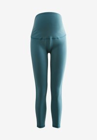 Hoogwaardige turquoise leggings gemaakt van glad, rekbaar materiaal. Heeft een naadloos ontwerp en een aansluitende pasvorm voor comfort en flexibiliteit.