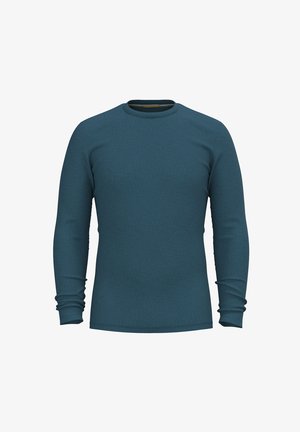 Långärmad skjorta i teal färg av strukturerad tyg med rund halsringning. Åtsittande design med samlade manschetter på ärmarna.