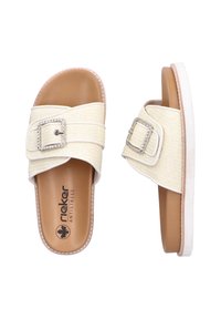 Textured cream sandals with a wide strap, featuring a decorative buckle, anti-stress footbed, and a light-colored, flat sole.