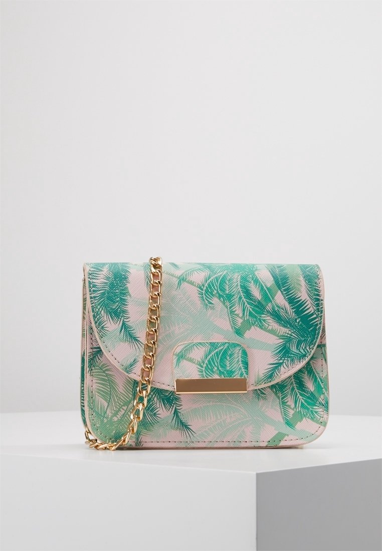 Green and pink printed handbag with palm leaf pattern, chain strap, curved flap, and gold-tone hardware. Synthetic material with a smooth texture.