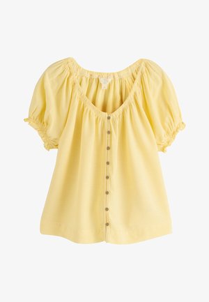 Gul hørbluse med knapper foran, puffede ærmer, elastisk halsudskæring og rynkede ærmekanter.