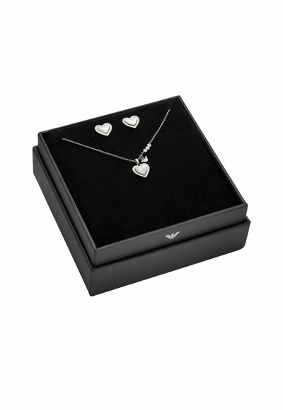 Silver heart-shaped necklace and earrings with mother-of-pearl inlay, presented in a black box with a soft black interior.