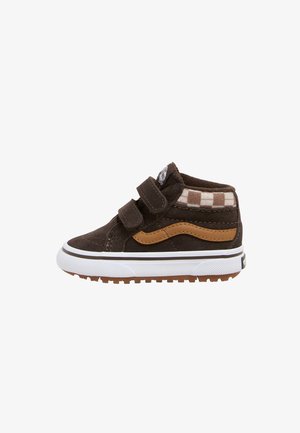 Brown toddler high-top sneaker with double velcro straps, checkered ankle collar, tan side stripe, white sole, and textured brown outsole.