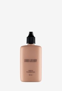 Lord & Berry creamfoundation i en 50 ml nude-flaska med ett svart, räfflat lock. Etiketten visar varumärkets namn och produktinformation i svart text.