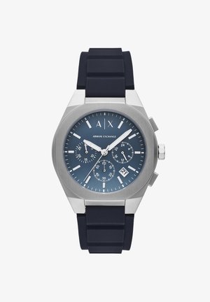 Navy silicone strap watch with a stainless steel case, blue dial, three sub-dials, and date display. Features silver hour markers and hands.