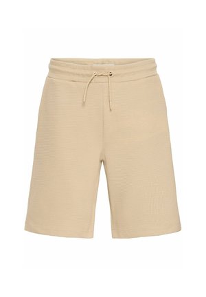 Bež kratke hlače iz teksturiranega materiala z elastičnim pasom na vrvico. Imajo ohlapen kroj in dolžino do kolen.