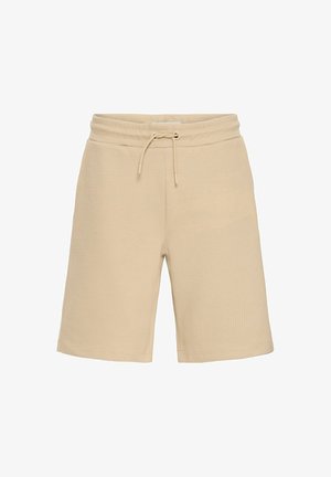 Bež kratke hlače iz teksturiranega materiala z elastičnim pasom na vrvico. Imajo ohlapen kroj in dolžino do kolen.
