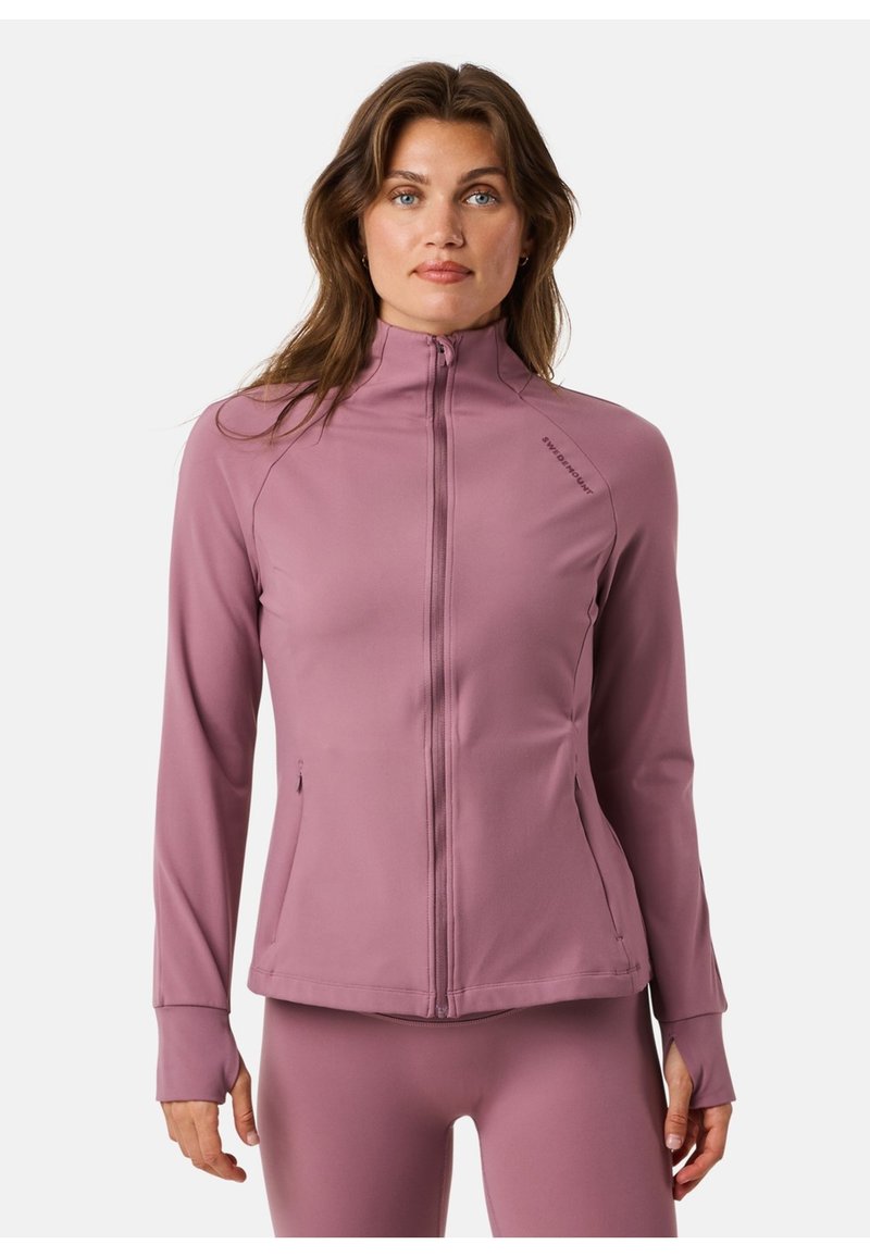 Długo-sleeve sportowa kurtka w miękkim, pastelowym różowym materiale. Posiada wysoki kołnierz, pełny zamek i zapinane na zamek kieszenie. Gładka tekstura.