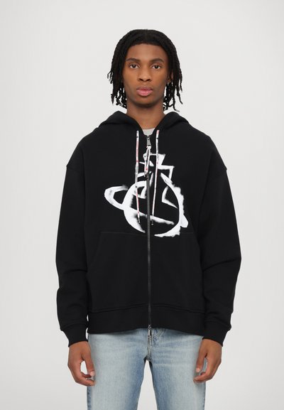 Black zip-up hoodie with a large white graphic design on the front. Features a drawstring hood and front kangaroo pocket.