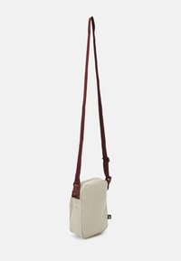 Nike Sportswear HERITAGE CROSSBODY UNISEX - Mala a tiracolo - stone/stone/bronze eclipse