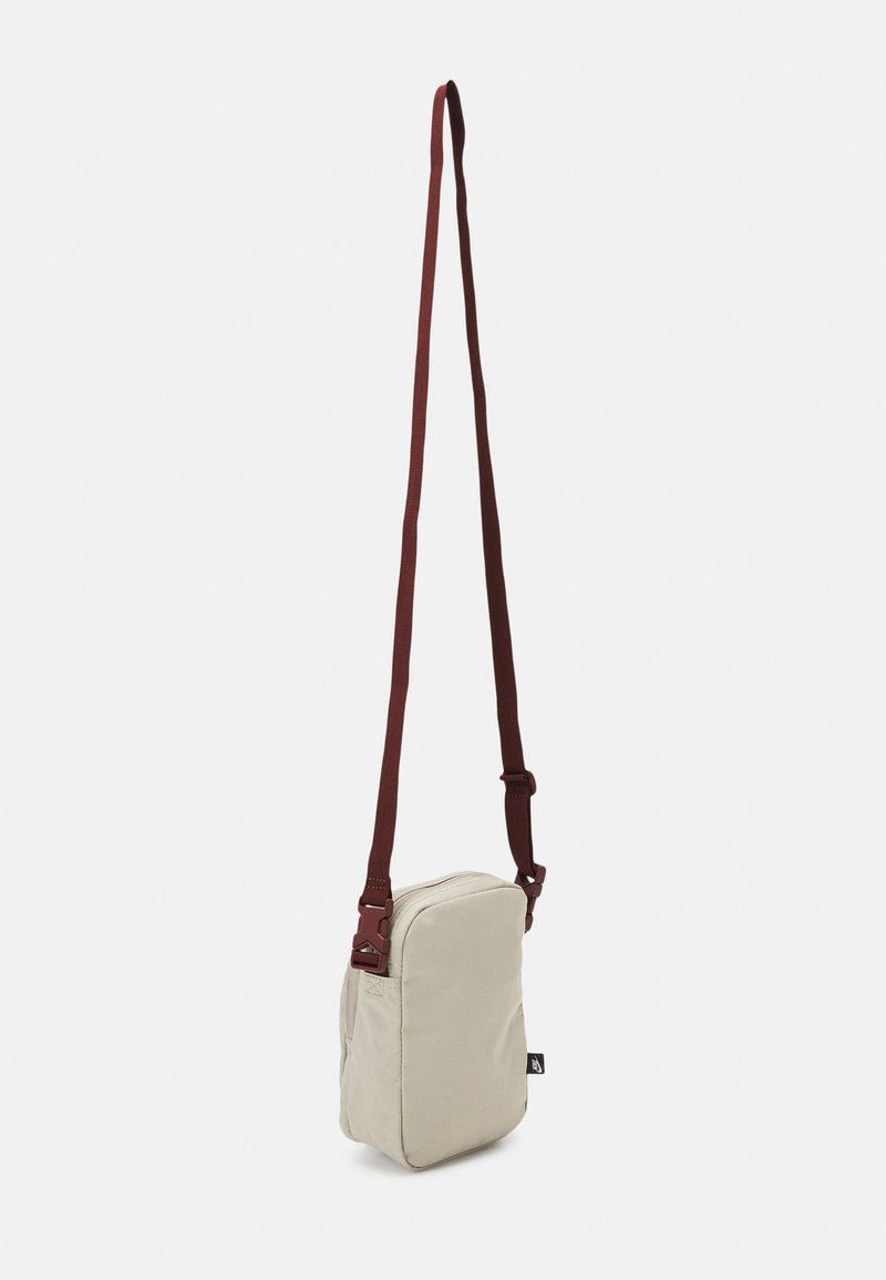 Nike Sportswear HERITAGE CROSSBODY UNISEX - Mala a tiracolo - stone/stone/bronze eclipse