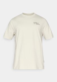 Κοντομάνικο μπέζ t-shirt από βαμβάκι, με μικρό μαύρο λογότυπο στην αριστερή περιοχή του στήθους και κλασική στρογγυλή λαιμόκοψη.