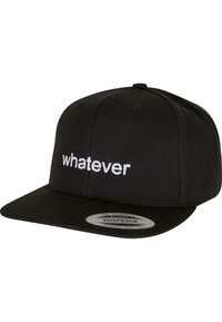 Black snapback cap with a flat visor, featuring white embroidered text "whatever" on the front. Made of textured fabric with a structured design.