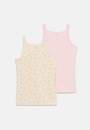 Zwei Damen-Topfs: eines in Creme mit kleinem Blumenmuster, das andere einfarbig pink. Beide verfügen über dünne Spaghettiträger und eine samtweiche Textur.