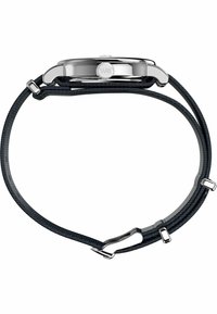 Stainless steel watch with a round case and black fabric strap. The strap features a textured pattern and metal accents for fastening.