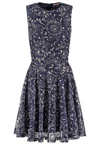 Robe bleu marine sans manches avec superposition de dentelle florale beige, taille cintrée, jupe évasée et encolure ronde avec fermeture éclair dans le dos.