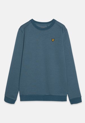 Felpa blu con maniche lunghe, scollo rotondo, polsini a costine e un piccolo logo di un uccellino giallo sul petto. Tessuto morbido.