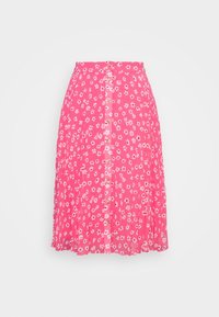 Jupe florale rose au design fluide, dotée d'une fermeture à boutons sur le devant et de motifs de fleurs blanches sur un fond rose clair.