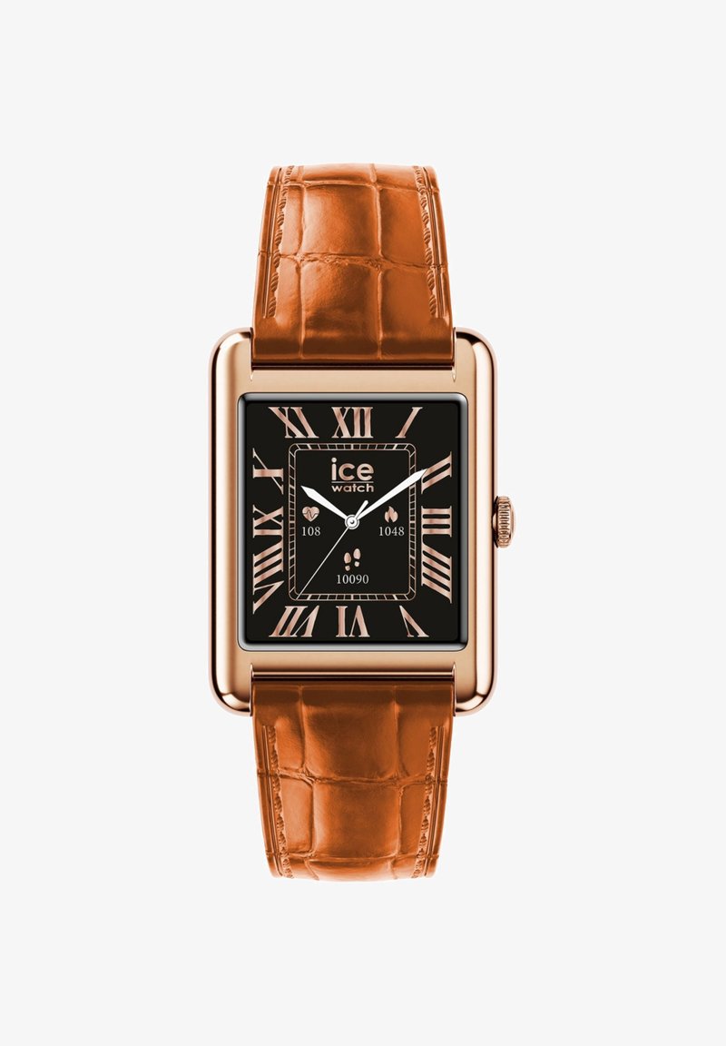 Orologio rettangolare con cassa in rosso oro e quadrante nero. Cinturino in pelle a motivo coccodrillo marrone. Numeri romani alle 12, 3, 6 e 9.