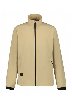 Veste softshell beige avec col montant, fermeture éclair noire et deux poches latérales. Présente des accents noirs aux poignets. Texture lisse.
