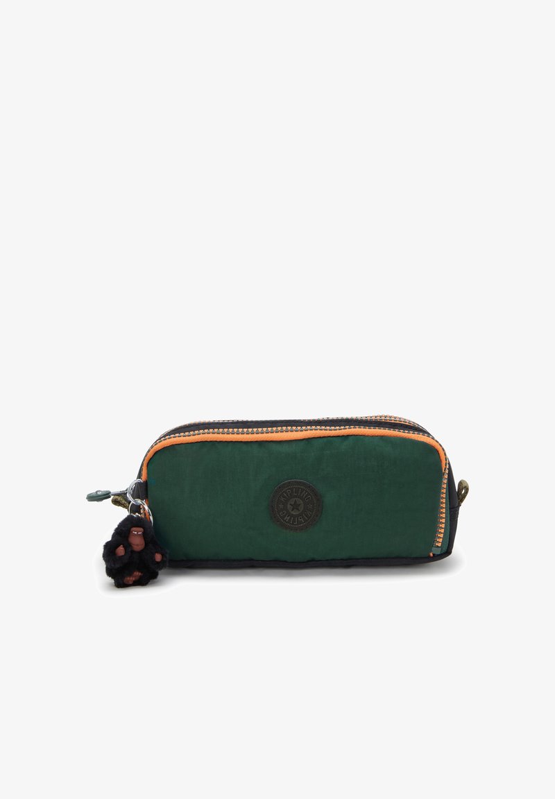Green fabric pencil case with orange zipper trim, featuring a logo patch and a black monkey keychain charm. Rectangular shape, soft texture.