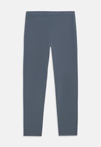 Dark gray leggings with a smooth, stretchy fabric. Features an elastic waistband and fitted design, tapering toward the ankle.