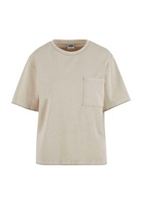 T-shirt en coton beige avec une coupe décontractée, des manches courtes, un col rond et une poche poitrine. Texture lisse avec des coutures visibles.