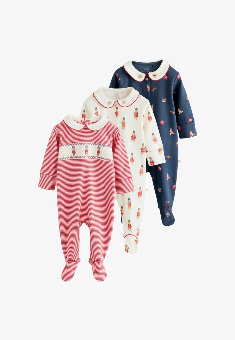 Trois grenouillers pour bébés : rayé rouge, crème avec impression de casse-noisette et marine avec accents festifs. Tous ont des cols ronds et des jambes avec pieds.