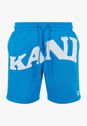 Pantalones cortos de algodón azul con un gran logo de toalla blanca "KANI". Cintura con cordón y bolsillos laterales. Textura suave con cintura elástica.