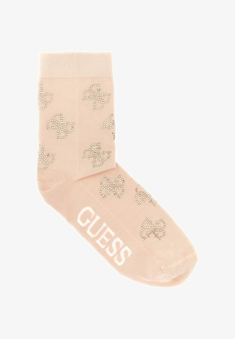Lyserød ankelstrømpe lavet af blødt materiale, med et glitrende sløjfemønster og ordet "GUESS" i hvidt ved anklen.