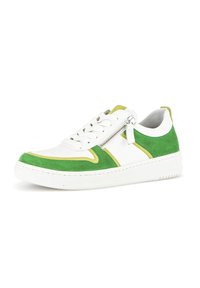 White sneaker with green and yellow suede accents, featuring a side zipper, round toe, and textured rubber sole.