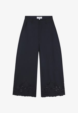 Wide-legged pants in navy fabric, featuring floral embroidery, decorative lace trim, and side pockets for added detail.