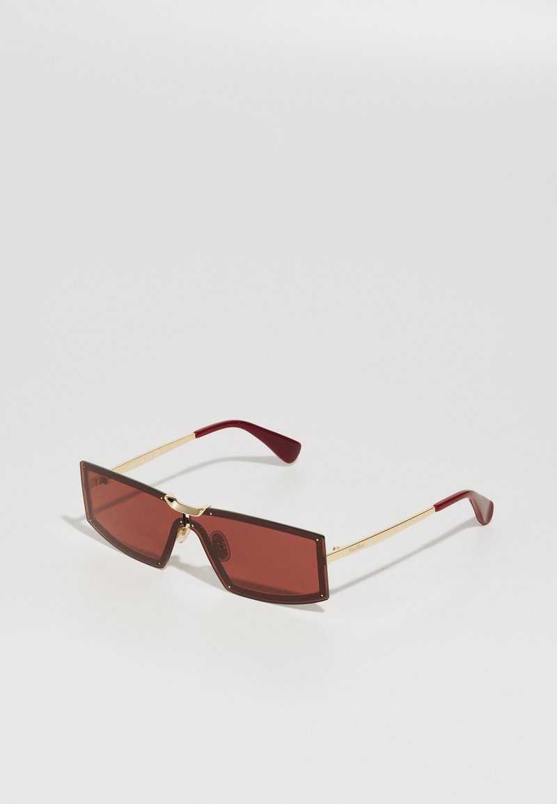 Rectangular sunglasses with brown tinted lenses, gold metal frames, and burgundy-accented arms. Features a unique geometric design.
