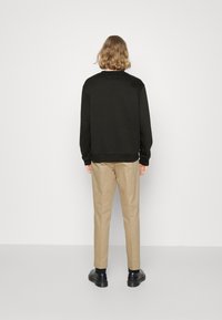 Calvin Klein Jeans MONOLOGO BOX CREW NECK - Melegítőfelső - black