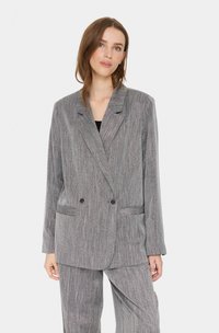 Gray striped blazer in a relaxed fit, featuring wide lapels, double buttons, and front pockets. Material has a textured finish.