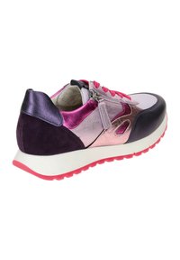 Multicolored sneaker featuring a mix of textured materials, including shiny pink and purple accents, pink laces, and a white sole.