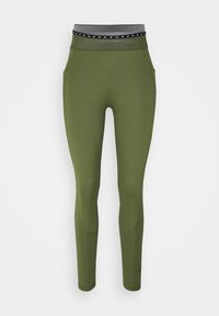 Olivově zelené legíny vyrobené z elastického materiálu s černobílým pruhovaným pasem, s bočními kapsami a přiléhavým střihem.