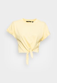 Żółta skrócona koszulka wykonana z miękkiej bawełny, z krótkimi, podwiniętymi rękawami oraz szczegółem w postaci węzła z przodu.