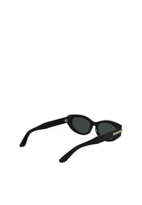 Black cat-eye sunglasses with dark lenses, a glossy plastic frame, and metal accents on the temples. Smooth texture with a sharp silhouette.