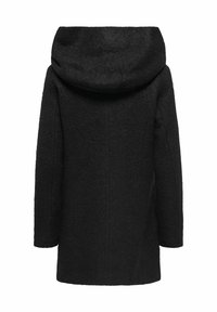 Manteau en laine noir avec une grande capuche douce, des manches longues et une coupe droite. La texture est légèrement polaire sans fermetures visibles.