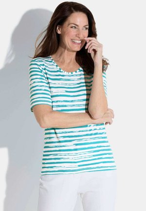 T-shirt rayé en tissu doux, avec des rayures horizontales turquoise et blanches, col rond et manches courtes.