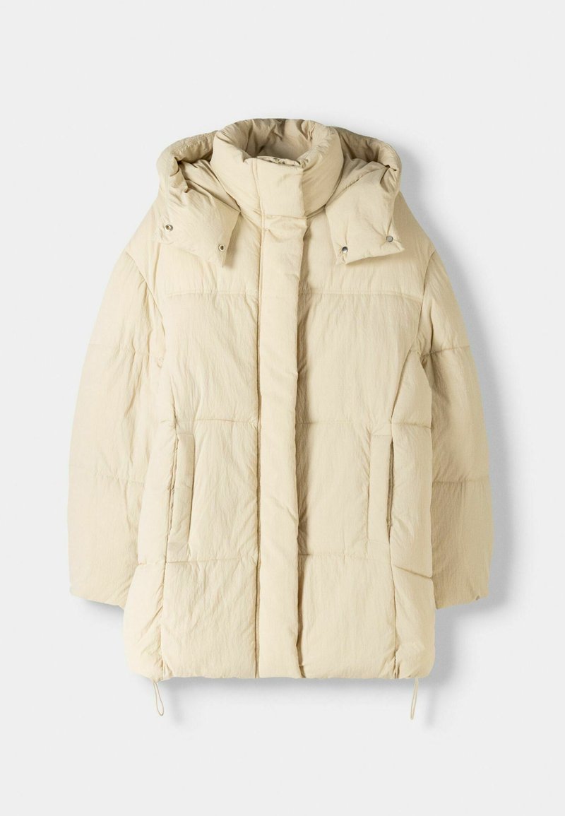 Giacca a vento beige con colletto alto e cappuccio, caratterizzata da sezioni trapuntate, due tasche laterali e regolazioni del fondo con coulisse.